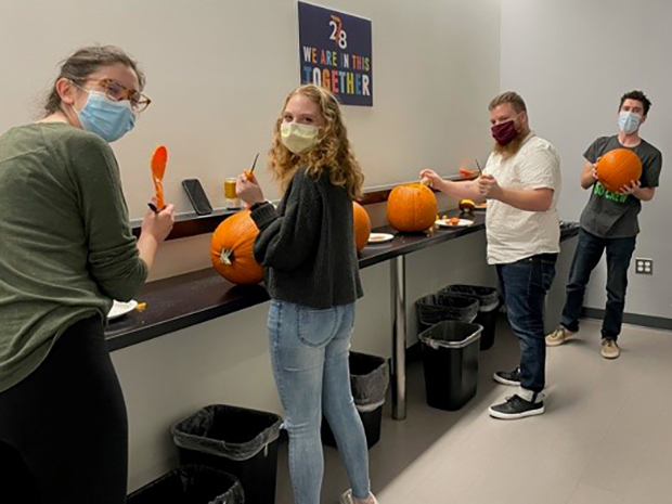 Redona team carving pumpkins